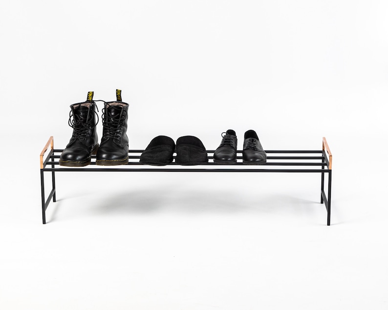 Minimalist black metal shoe rack. Hand welded in Ukraine by us. Ready to use right out of the box.