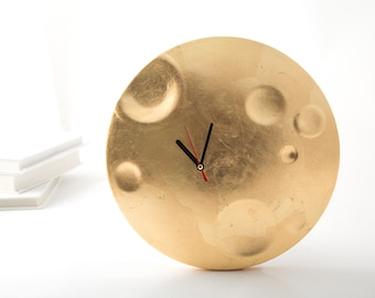 Wanduhr aus Mond, Vergoldung