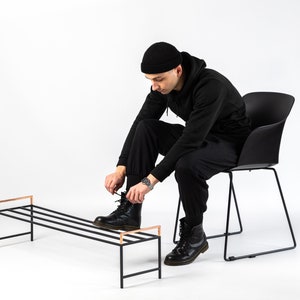 Black metal shoe rack with copper handles. Hand Welded in Ukraine. Hand welded from high grade steel square tube. Design Atelier Article on Etsy