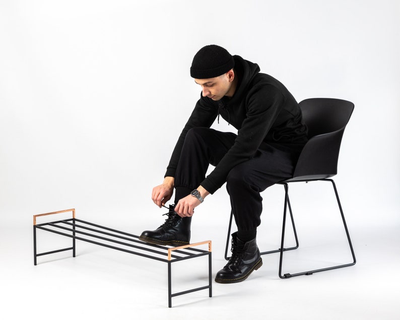 Black metal shoe rack with copper handles. Hand Welded in Ukraine. Hand welded from high grade steel square tube. Design Atelier Article on Etsy