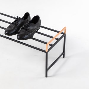 Black metal shoe rack with copper handles. Hand Welded in Ukraine. Hand welded from high grade steel square tube. Design Atelier Article on Etsy