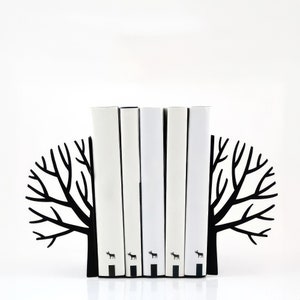 Black metal modern bookends in the minimalist style "Winter Trees. " Two halves of the tree with naked branches hold the bookends from the sides. Flat laser-cut bookends hold any number of books. Made by us in a small workshop.