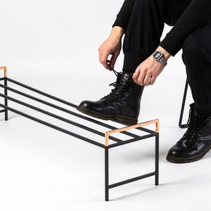 Black metal shoe rack with copper handles. Hand Welded in Ukraine. Hand welded from high grade steel square tube. Design Atelier Article on Etsy