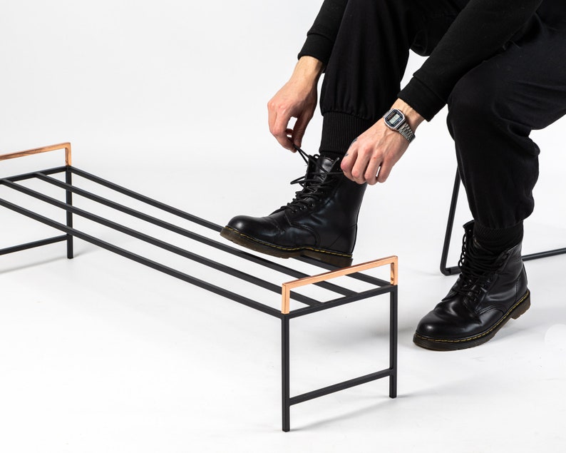 Black metal shoe rack with copper handles. Hand Welded in Ukraine. Hand welded from high grade steel square tube. Design Atelier Article on Etsy