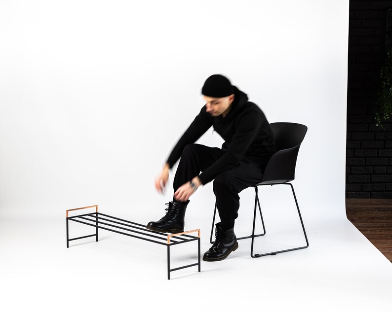 Black metal shoe rack with copper handles. Hand Welded in Ukraine. Hand welded from high grade steel square tube. Design Atelier Article on Etsy