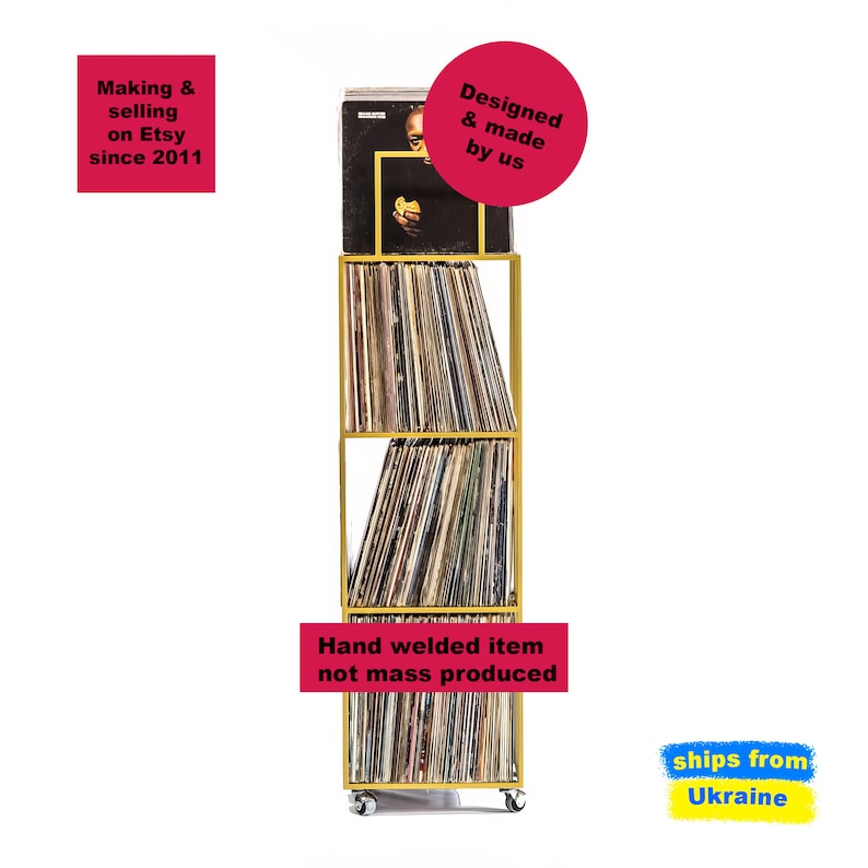 Front view of gold four-tier metal vinyl record stand on wheels, filled with LP albums, minimalist square steel frame, hand-welded in Ukraine.