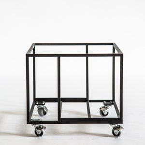 Empty black metal vinyl record cart frame with a minimalist square design, shown on four smooth-rolling caster wheels against a white background.