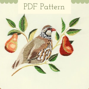 May include: Embroidered design of a bird on a branch with pears. The bird has brown, white, and black feathers, a red beak, and is surrounded by green leaves and two orange-red pears. The text "PDF Pattern" is at the top.