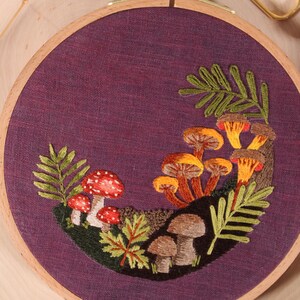 close up of a colorful mushroom embroidery pattern
