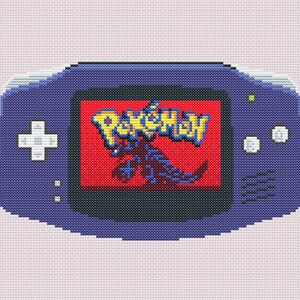 May include: A cross-stitch pattern of a purple handheld video game console. The screen displays a red background with the yellow Pokémon logo and a dark blue creature silhouette. The console features a white directional pad and two white buttons.