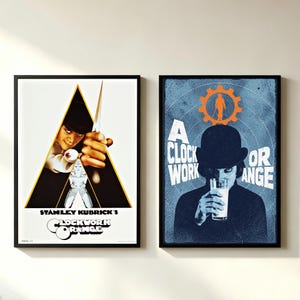 May include: Two framed movie posters for A Clockwork Orange. The left poster features a triangular graphic with a person in a bowler hat and the text Stanley Kubrick's Clockwork Orange. The right poster shows a person in a bowler hat drinking milk.