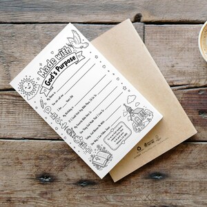 May include: A white paper activity sheet with black line art featuring the text Made with God's Purpose, a sun, a dove, a church, and a Bible. The sheet includes fill-in-the-blank lines for personal details and a quote from Ephesians 2:10.