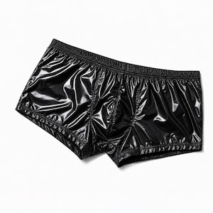 May include: Black boxer briefs made of a shiny, wet-look material. These shorts feature a wide, elasticized waistband and a contoured front pouch design with visible stitching along the seams, creating a sleek and reflective appearance.