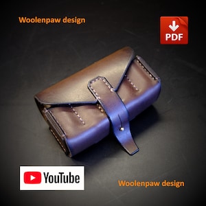 May include: A dark brown leather case featuring a flap closure secured by a vertical strap and a small metal stud. The item displays visible stitching along the edges and includes the text Woolenpaw design, a PDF icon, and a YouTube logo.