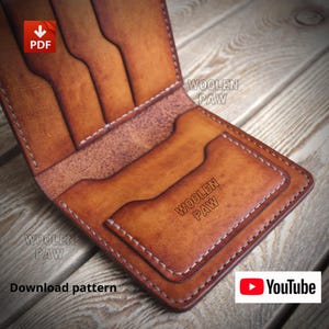 May include: A tan leather bifold wallet featuring multiple card slots and a central pocket. The wallet is embossed with the text WOOLEN PAW. The image includes a red PDF icon, the text WOOLEN PAW, and a YouTube logo with the text Download pattern.