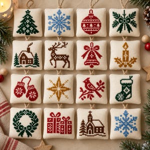 May include: A set of sixteen square, cream-coloured fabric ornaments featuring various cross-stitched holiday designs in red, green, blue, and gold. Each ornament is suspended by a jute twine loop and displays motifs including trees, snowflakes, reindeer, bells, candles, mittens, stars, birds, stockings, wreaths, gifts, and churches.