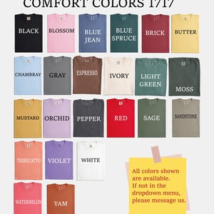 a collection of 17 different colored t-shirts, each with a unique color and design.