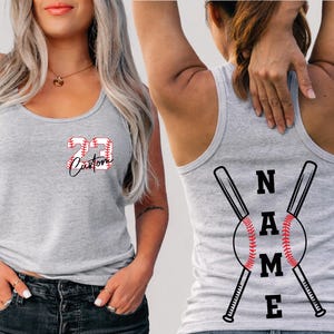 A woman wearing a gray tank top with a baseball design and the number 23 on it.