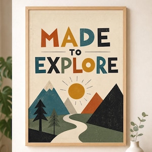 May include: A framed wall art print featuring the text MADE TO EXPLORE in multi-coloured block letters. Below the text is a graphic illustration of a yellow sun, blue and orange mountains, a winding white path, and two black pine trees.