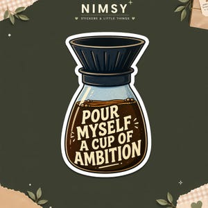 May include: A die-cut sticker featuring a glass coffee pour-over carafe filled with dark brown coffee. The text "POUR MYSELF A CUP OF AMBITION" is printed in cream-colored capital letters across the center of the glass carafe body.