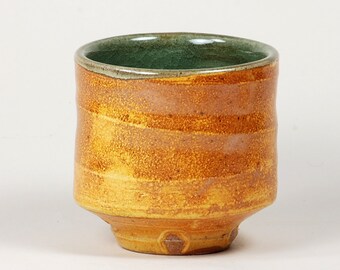 Salt-fired yunomi with lively outside slip and celadon glaze inside