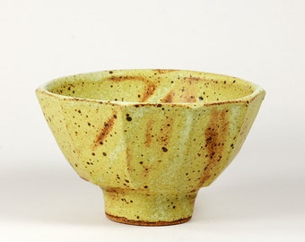 Faceted stoneware serving bowl, matte yellow glaze