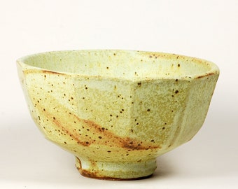 Faceted stoneware serving bowl in yellow glaze