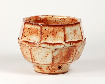 Shino glaze stoneware serving bowl with faceted sides