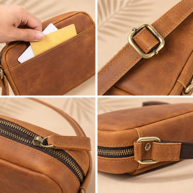 May include: A brown leather crossbody bag featuring a smooth matte finish, an exterior slip pocket, a top zipper closure with a matching leather pull tab, and an adjustable strap secured by antique brass-toned metal buckles and hardware.