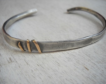 Zilveren en gouden armband. Heren armband. cadeau voor mannen. Sterling zilveren armband met 14k gouden draad eromheen gewikkeld.