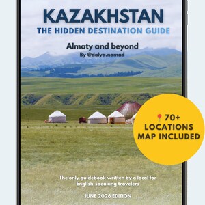 Peut inclure: Une tablette numérique affichant un guide de voyage intitulé KAZAKHSTAN THE HIDDEN DESTINATION GUIDE, Almaty and beyond par @dalya.nomad. La couverture montre un paysage avec des yourtes, un cercle jaune 70+ LOCATIONS MAP INCLUDED et JUNE 2026 EDITION.