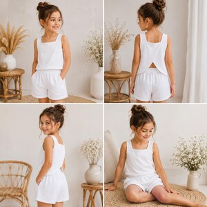 May include: A white two-piece set consisting of a sleeveless tank top with a square neckline and matching shorts with side pockets. The top features a split back design, and the shorts have an elasticated waistband for a comfortable fit.
