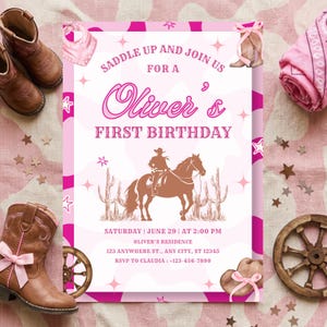 May include: A rectangular birthday invitation card featuring a pink and white cow print background with a central illustration of a cowboy on a horse near cacti. The text reads: SADDLE UP AND JOIN US FOR A Oliver's FIRST BIRTHDAY.