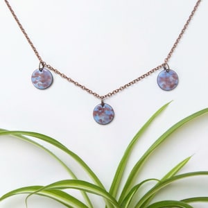 Short chain with three marbled painted enamel pendants