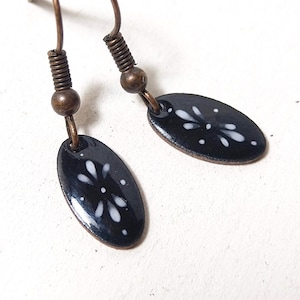 black oval enamel earrings with ornament