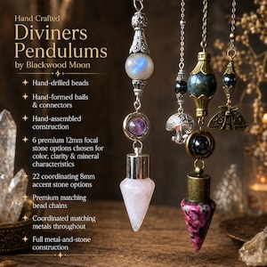 May include: Two hanging diviner pendulums featuring 12mm focal stones and 8mm accent stones on metal chains. The left pendulum has a moonstone, amethyst, and rose quartz point. The right has a dark stone, moth charm, and pink speckled point.