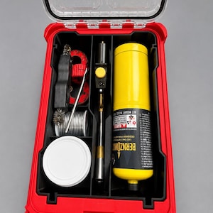 May include: A red plastic storage case with a clear lid containing a yellow Bernzomatic fuel cylinder, a metal torch head with a yellow ignition button, a spool of silver solder, a wire brush, a red pipe cutter, and a white circular container.