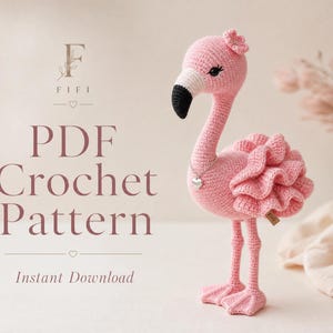 May include: A pink crocheted flamingo toy with a black-tipped beak, a small flower on its head, and a silver heart-shaped pendant necklace. The text reads FIFI PDF Crochet Pattern Instant Download, featuring a stylized letter F and heart icons.