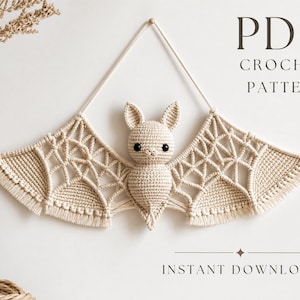 May include: A beige crochet bat wall hanging with macrame-style wings featuring intricate knotted patterns and black bead eyes. The text PDF CROCHET PATTERN and INSTANT DOWNLOAD is visible. The bat is suspended by a single cord for wall display.