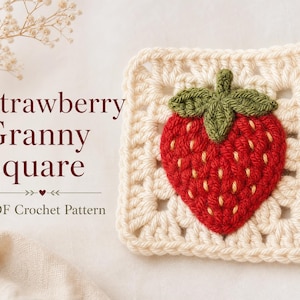 May include: A square crochet motif in cream yarn featuring a central three-dimensional red strawberry with green leaves and yellow seed details. The text reads Strawberry Granny Square PDF Crochet Pattern with a small heart icon between arrows.