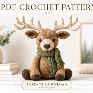 May include: A PDF crochet pattern for a stuffed reindeer toy. The reindeer is light brown with dark brown hooves, a cream-colored muzzle, and large cream antlers. It wears a textured olive green scarf with fringe. Text reads PDF CROCHET PATTERN.