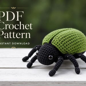 May include: A PDF crochet pattern instant download featuring a handmade amigurumi beetle with a textured green shell and a black body. The insect has six black legs and two small black bead eyes. The text PDF Crochet Pattern is visible.