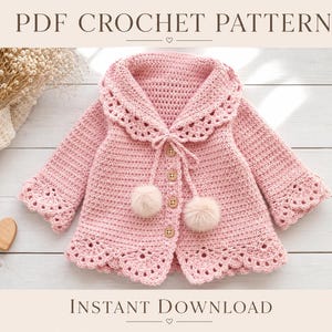 May include: A light pink crochet cardigan featuring a wide scalloped collar, long sleeves with matching scalloped cuffs, and a scalloped hem. The front closure includes four wooden buttons and two decorative pom-poms on thin ties.