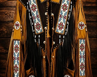 May include: A tan and dark brown jacket featuring long fringe, a collar, and intricate beadwork panels in red, white, blue, and green geometric star patterns. The garment includes circular beaded patches on the sleeves and pockets with lace closures.