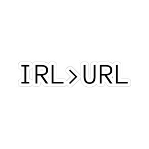 May include: A die-cut sticker featuring the black text IRL > URL in a clean, sans-serif font. The design is surrounded by a thin white border that follows the contour of the letters, creating a distinct outline against the background.