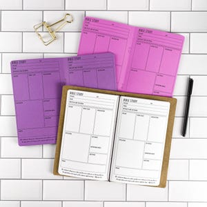 May include: Three open Bible study journals with printed templates for passage, theme, outline, word study, observations, application, key verses, supporting verses, questions, and prayer. One journal is white, one is purple, and one is bright pink.