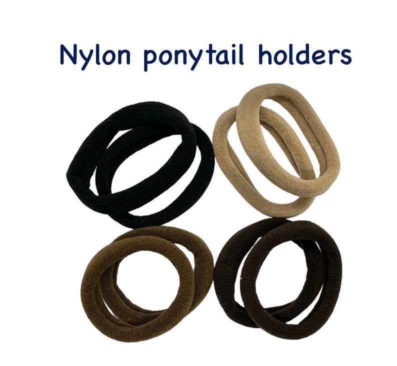 May include: A set of six nylon ponytail holders in black, brown, and beige. The holders are arranged in pairs, with two of each color.