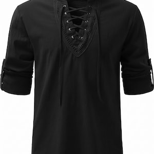 May include: A black long-sleeve shirt featuring a V-neckline with a lace-up closure, silver-toned metal eyelets, and decorative stitching around the collar. The sleeves are rolled up and secured with a button tab, and the label reads JOGAL.