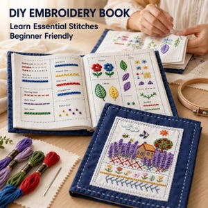 May include: A DIY embroidery book with a dark blue cover, featuring pages that display various stitch techniques like chain, satin, and French knots, alongside colourful floral and landscape embroidery samples, plus embroidery floss and a wooden hoop.