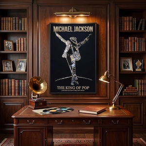 May include: A framed art print featuring a silhouette of Michael Jackson in a dynamic pose against a black background. The text reads MICHAEL JACKSON and THE KING OF POP LIMITED EDITION FINE ART PRINT. The print is displayed on a wood wall.